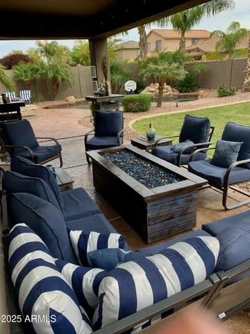 a view of swimming pool with outdoor seating