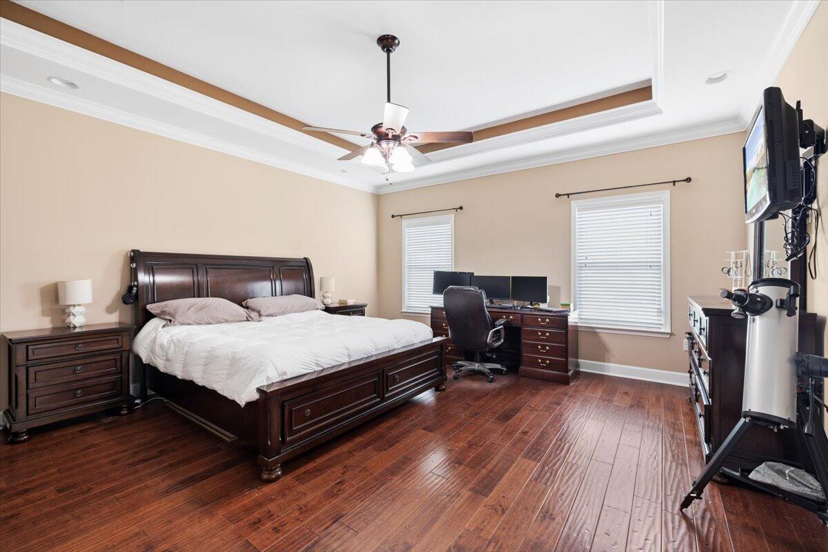 7938 Steel Mill Creek Road Laurel Hill, FL 32567 - Photo 14 of 33 a bedroom with a bed and wooden floor