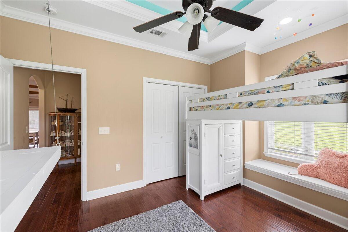7938 Steel Mill Creek Road Laurel Hill, FL 32567 - Photo 18 of 33 a view of a hallway view with wooden floor and staircase
