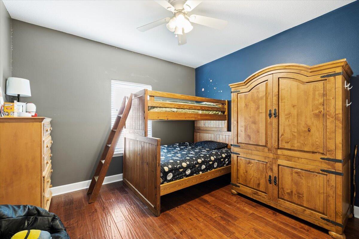 7938 Steel Mill Creek Road Laurel Hill, FL 32567 - Photo 23 of 33 a bedroom with a bed and a dresser