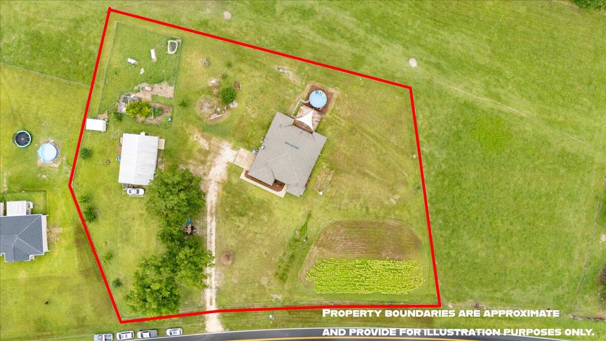 7938 Steel Mill Creek Road Laurel Hill, FL 32567 - Photo 4 of 33 view of a swimming pool