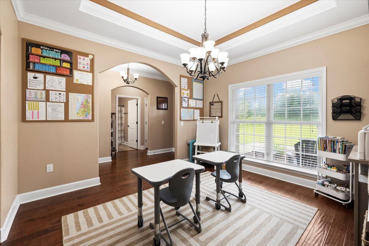 7938 Steel Mill Creek Road Laurel Hill, FL 32567 - Photo 7 of 33 a view of a livingroom with furniture window and wooden floor