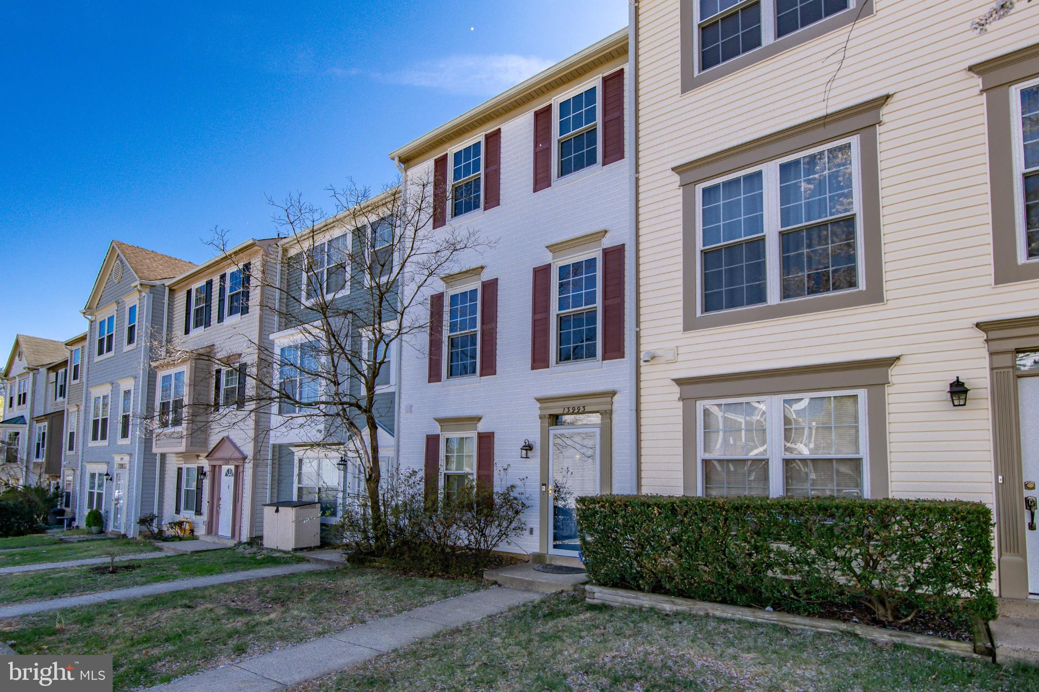 13993 Gunners Place Centreville, VA 20121 - Photo 2 of 43 a front view of a building with a yard