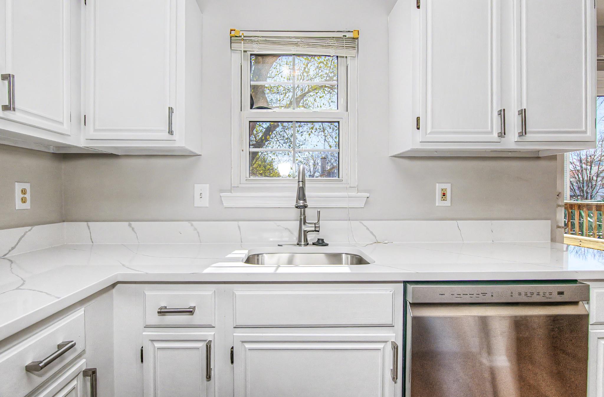 13993 Gunners Place Centreville, VA 20121 - Photo 22 of 43 a kitchen with white cabinets and a sink