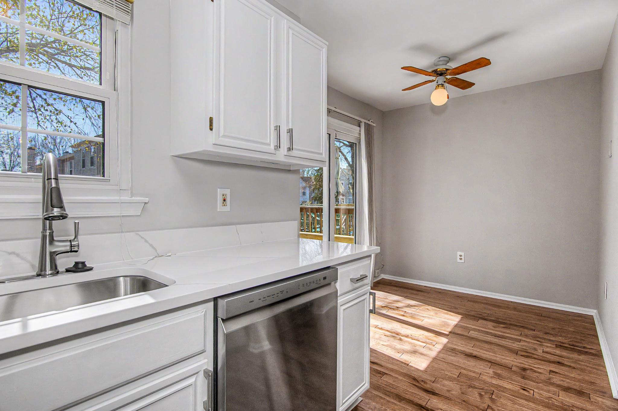 13993 Gunners Place Centreville, VA 20121 - Photo 24 of 43 a kitchen with granite countertop a sink and cabinets