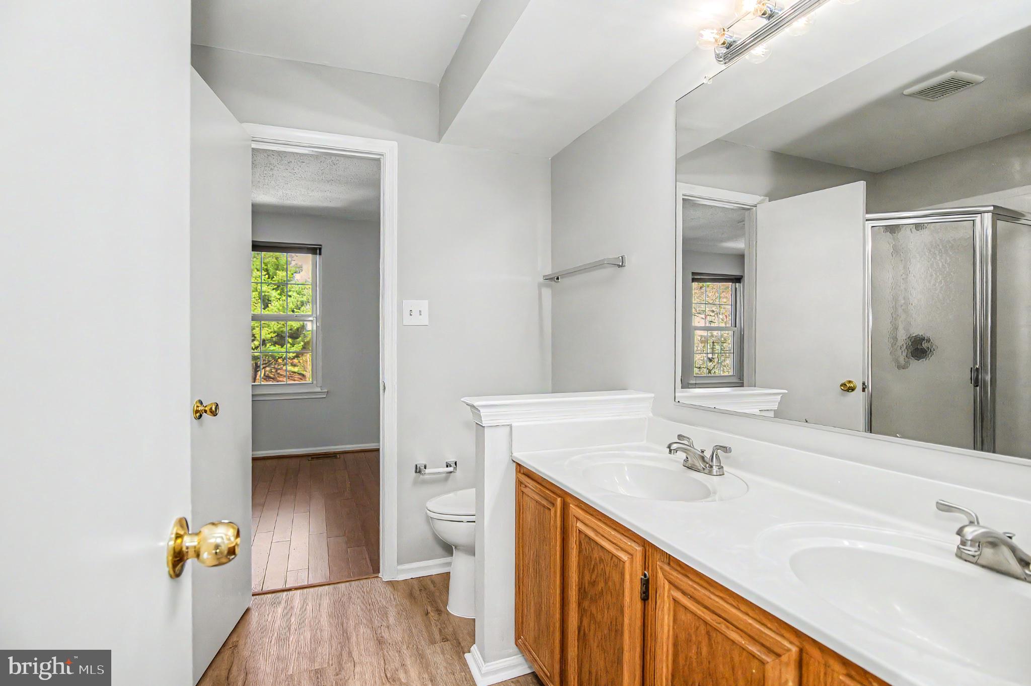 13993 Gunners Place Centreville, VA 20121 - Photo 29 of 43 a bathroom with a sink toilet and shower