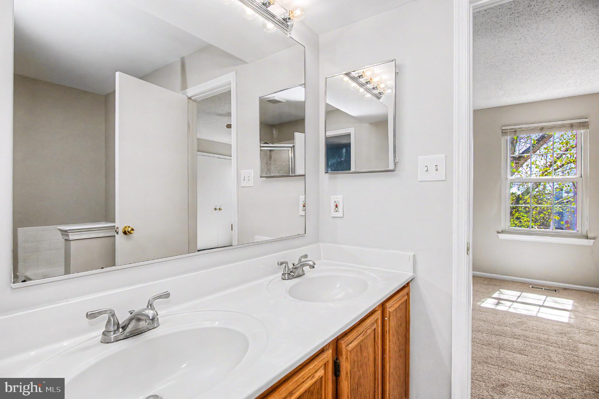 13993 Gunners Place Centreville, VA 20121 - Photo 30 of 43 a bathroom with a sink vanity and mirror