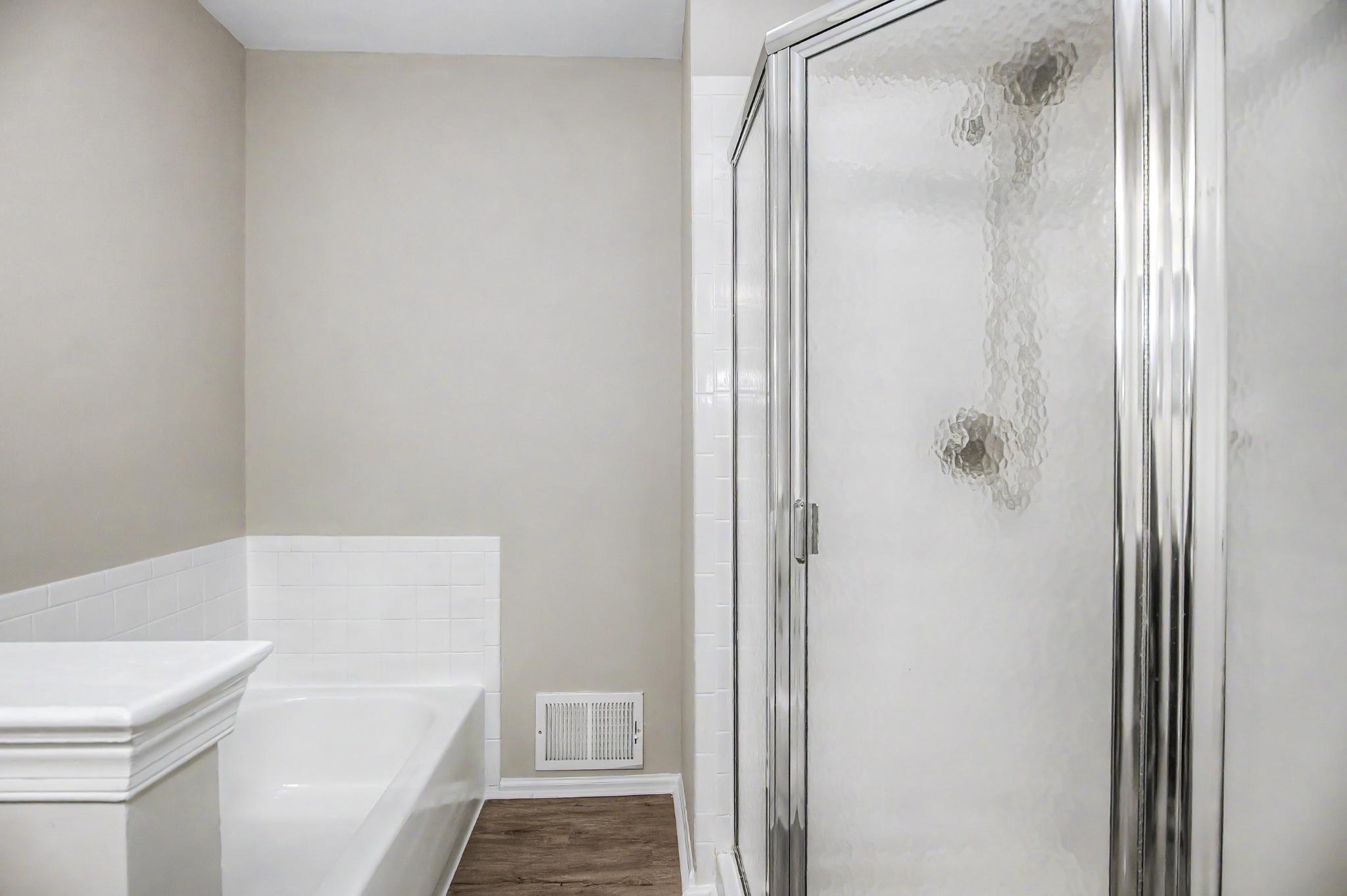 13993 Gunners Place Centreville, VA 20121 - Photo 31 of 43 a bathroom with a bathtub and a shower