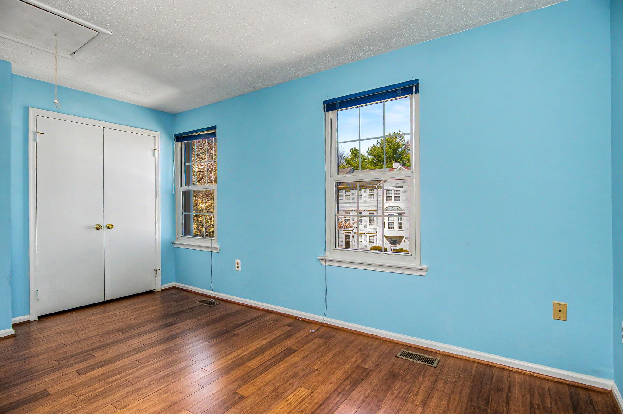 13993 Gunners Place Centreville, VA 20121 - Photo 35 of 43 an empty room with wooden floor and windows
