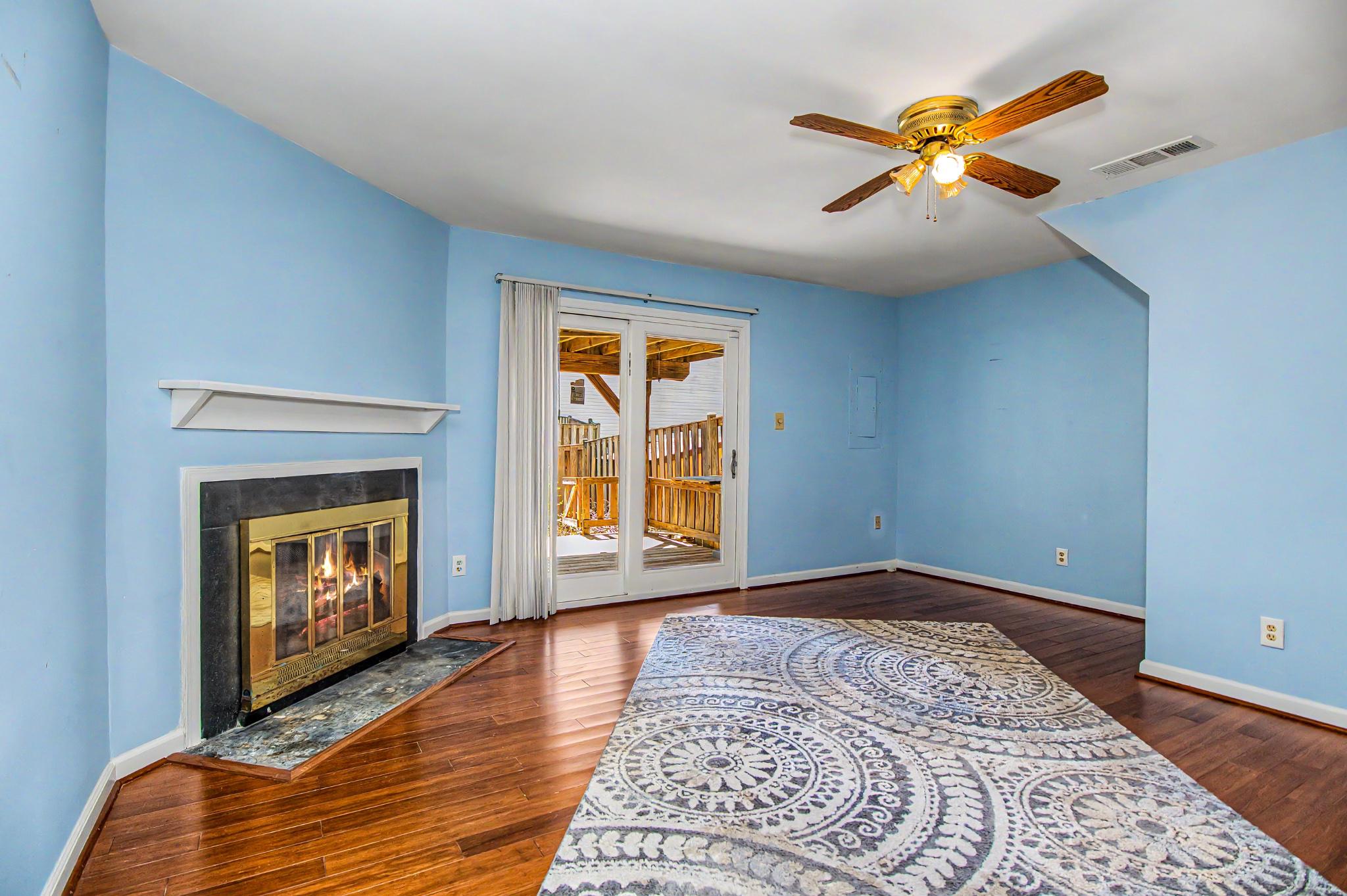 13993 Gunners Place Centreville, VA 20121 - Photo 5 of 43 a view of an empty room with window and wooden floor