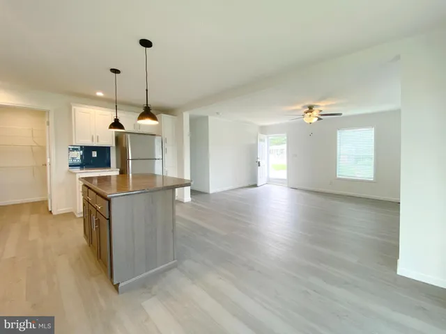 a kitchen with cabinets and a stove