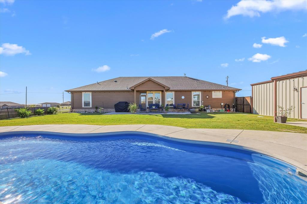 2375 County Road 4010 Decatur, TX 76234 - Photo 26 of 34 View of swimming pool with a fenced backyard and a patio