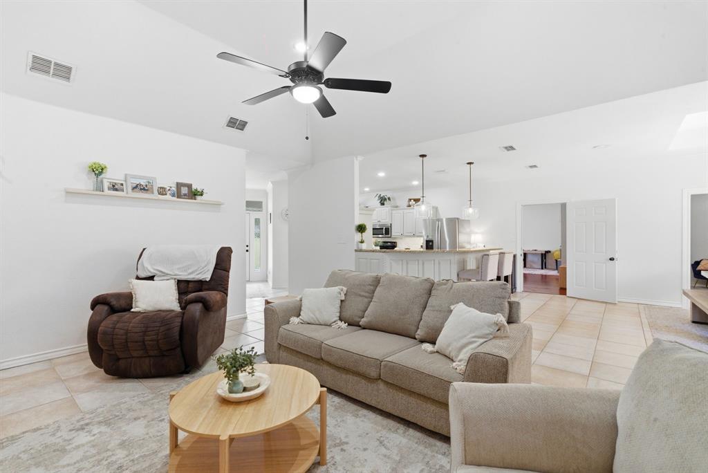 405 Zion Hill Road Weatherford, TX 76088 - Photo 14 of 38 Living area featuring a ceiling fan and light tile patterned floors