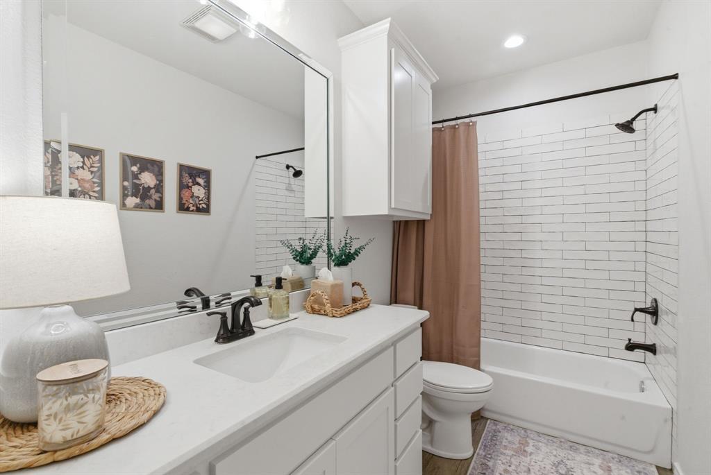 405 Zion Hill Road Weatherford, TX 76088 - Photo 18 of 38 Full bathroom with vanity, shower / bath combination with curtain, and recessed lighting
