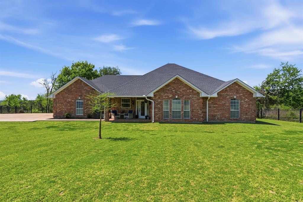 405 Zion Hill Road Weatherford, TX 76088 - Photo 2 of 38 Ranch-style home with brick siding, a porch, and a shingled roof