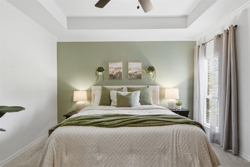 405 Zion Hill Road Weatherford, TX 76088 - Photo 21 of 38 Bedroom featuring carpet floors, a raised ceiling, and ceiling fan