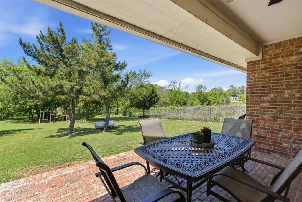 405 Zion Hill Road Weatherford, TX 76088 - Photo 29 of 38 View of patio / terrace with outdoor dining area and a ceiling fan