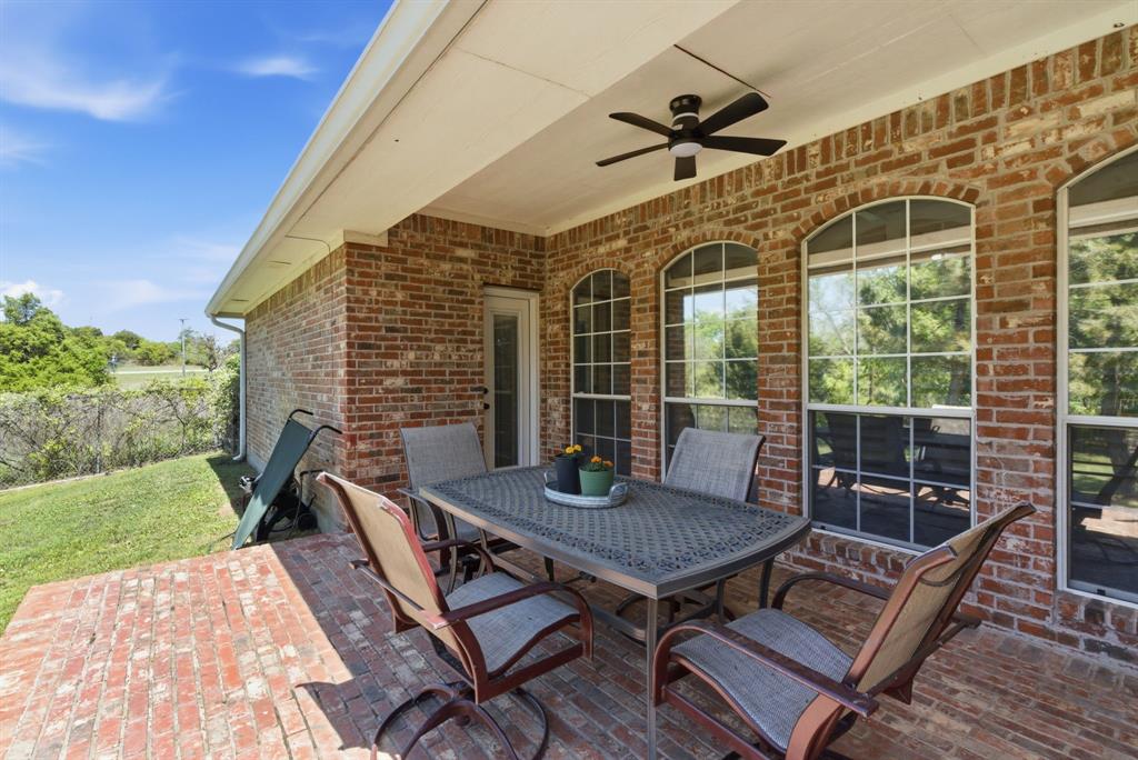 405 Zion Hill Road Weatherford, TX 76088 - Photo 31 of 38 View of patio / terrace with outdoor dining area and a ceiling fan