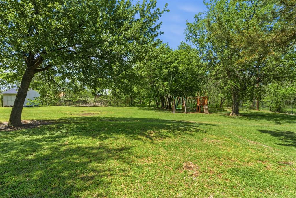 405 Zion Hill Road Weatherford, TX 76088 - Photo 33 of 38 View of green lawn featuring view of scattered trees