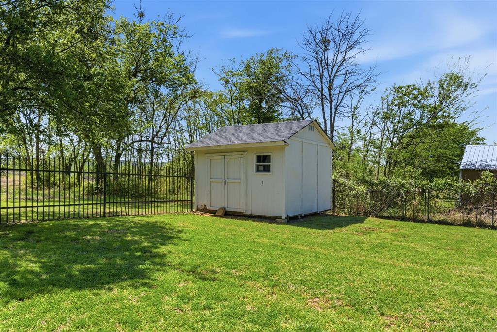 405 Zion Hill Road Weatherford, TX 76088 - Photo 34 of 38 View of shed with a fenced backyard