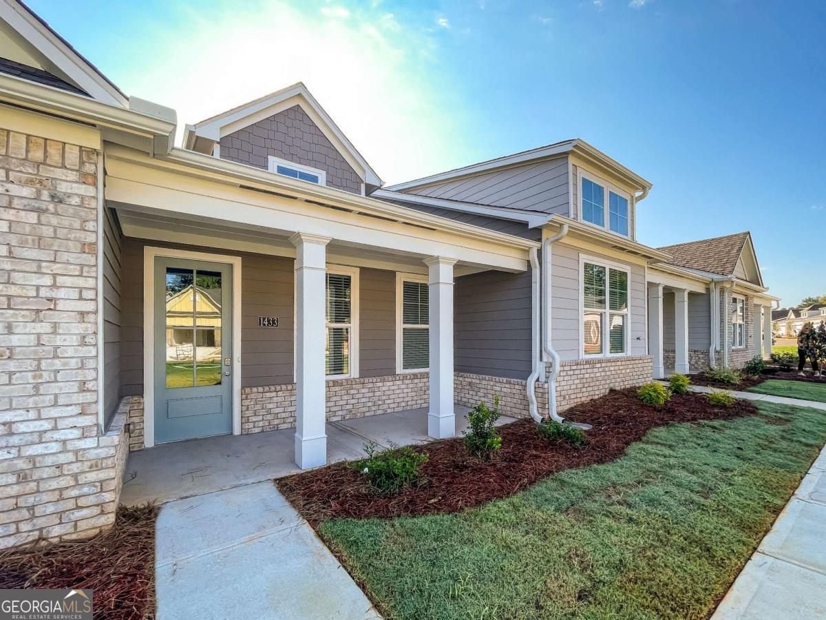 1638 Salinger Court, Unit 1638 Stockbridge, GA 30281 - Photo 1 of 18 a front view of a house with garden