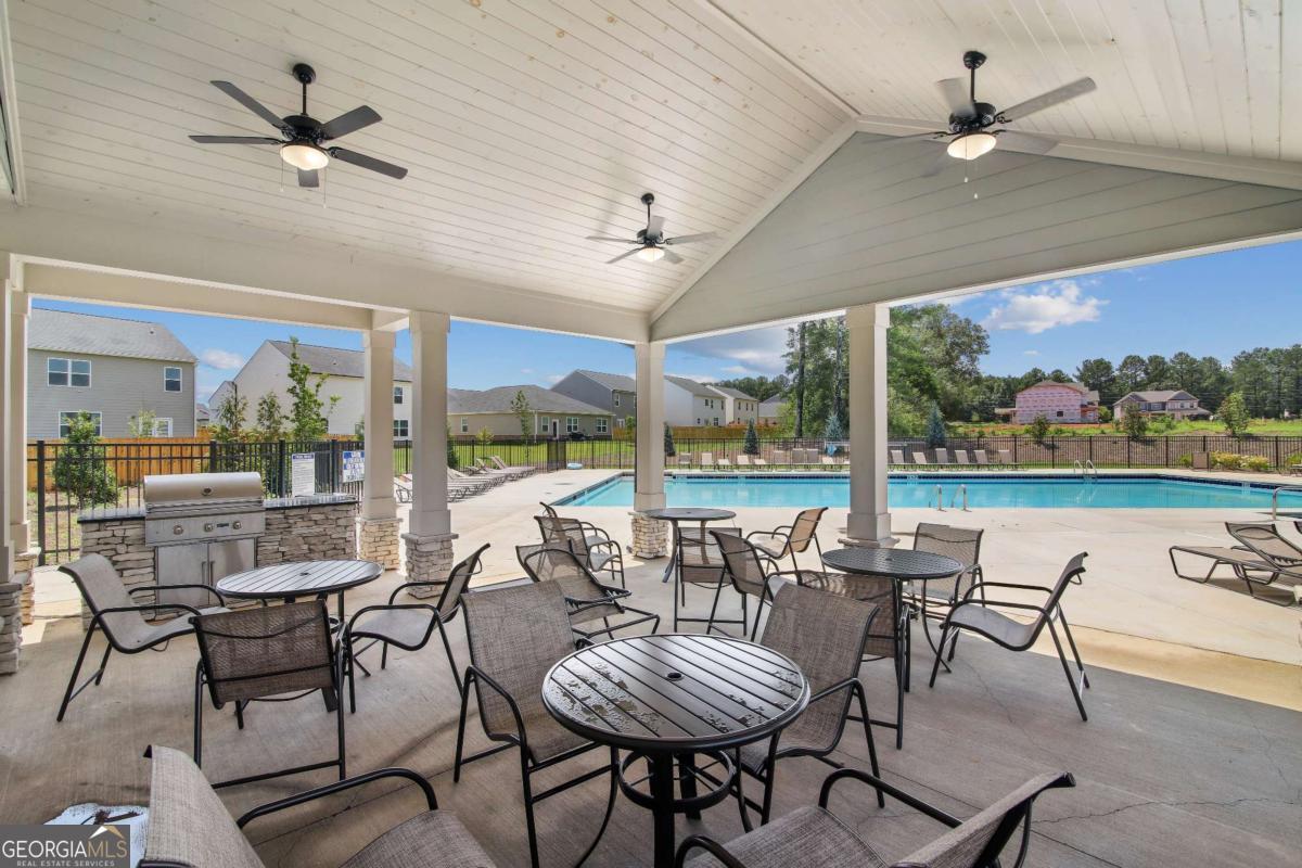1638 Salinger Court, Unit 1638 Stockbridge, GA 30281 - Photo 11 of 18 a view of a dining room with furniture window and outside view