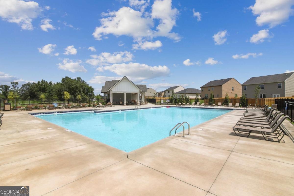 1638 Salinger Court, Unit 1638 Stockbridge, GA 30281 - Photo 13 of 18 a view of swimming pool with outdoor seating and plants