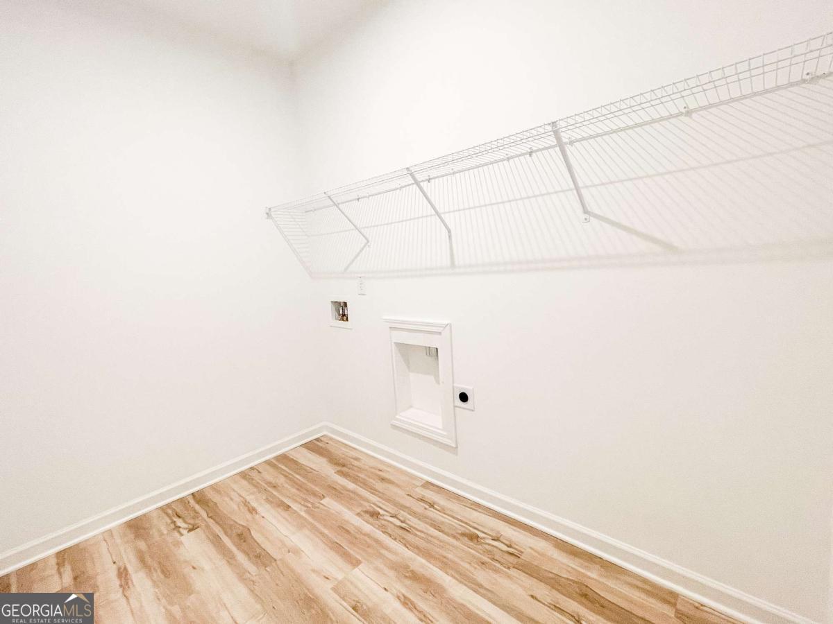 1638 Salinger Court, Unit 1638 Stockbridge, GA 30281 - Photo 17 of 18 a view of a room with racks on the wall