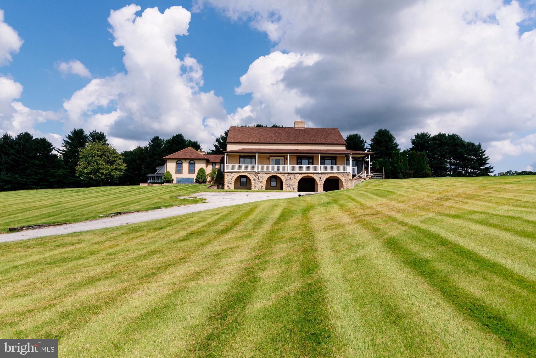 a view of swimming pool in front of the house