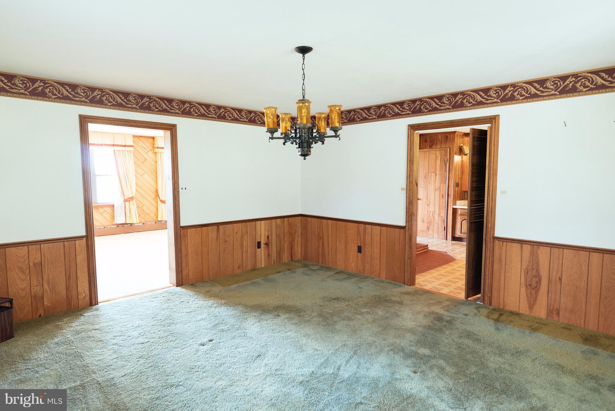 16600 York Road Monkton, MD 21111 - Photo 6 of 30 an empty room with windows and chandelier