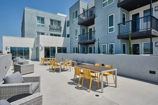 a view of a patio with couches table and chairs