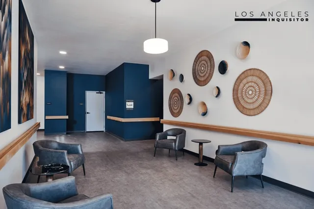 a view of a kitchen with fridge and outdoor seating