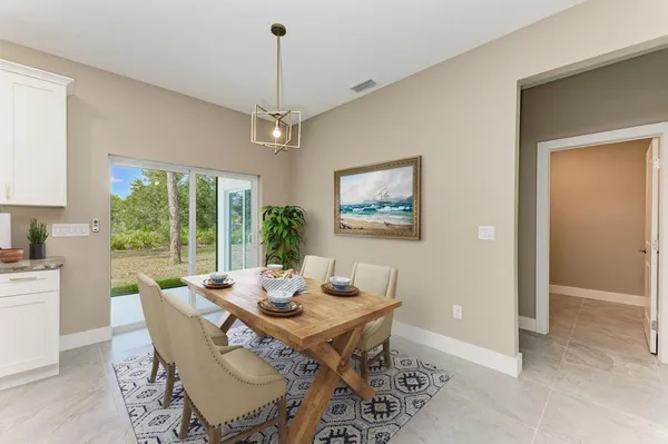 a view of a dining room with furniture window and outside view