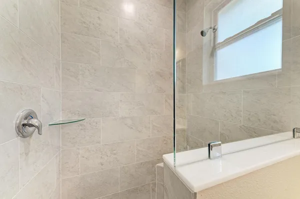 a bathroom with a sink and a shower
