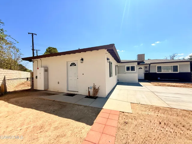 a view of a back yard of the house