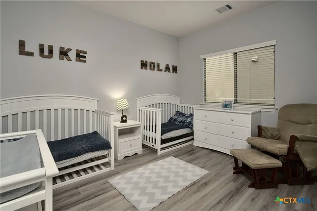 a bedroom with furniture and a window