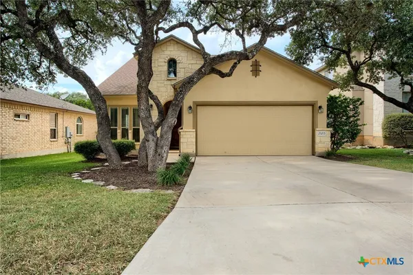 a front view of house with garage