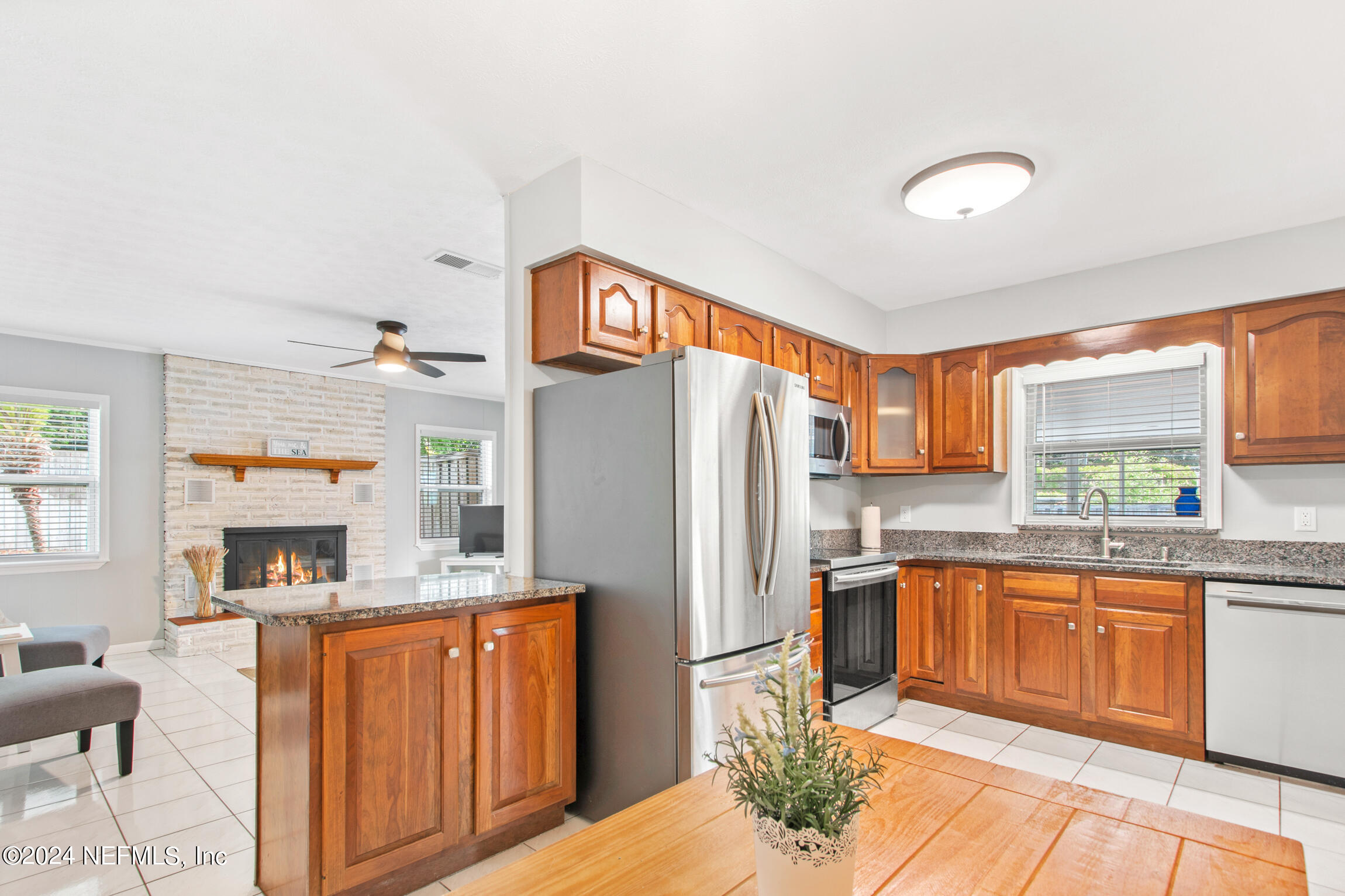14 Park Terrace Drive St. Augustine, FL 32080 - Photo 11 of 42 a kitchen with stainless steel appliances granite countertop a refrigerator sink and cabinets