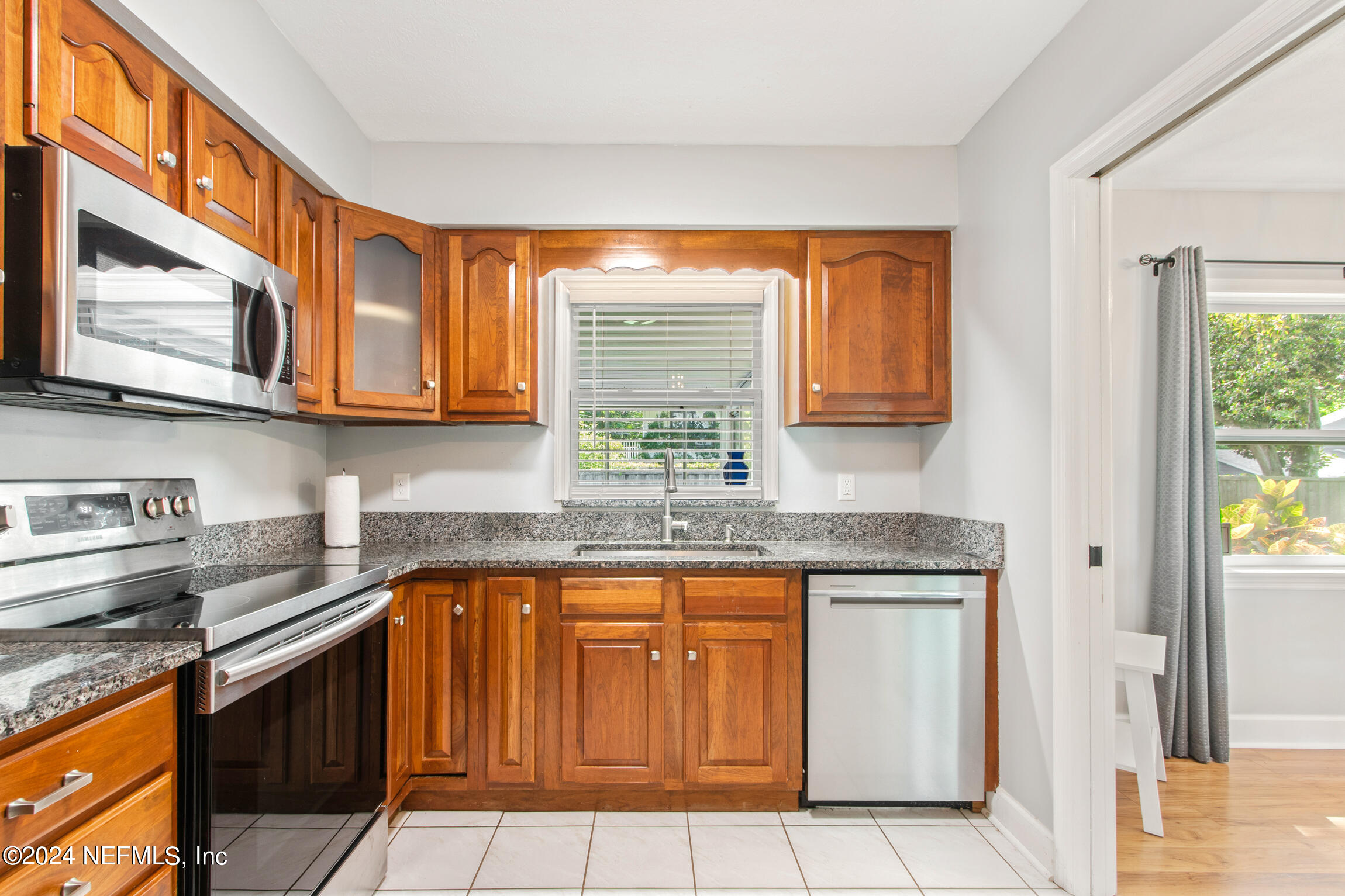14 Park Terrace Drive St. Augustine, FL 32080 - Photo 12 of 42 a kitchen with stainless steel appliances granite countertop a stove sink and cabinets