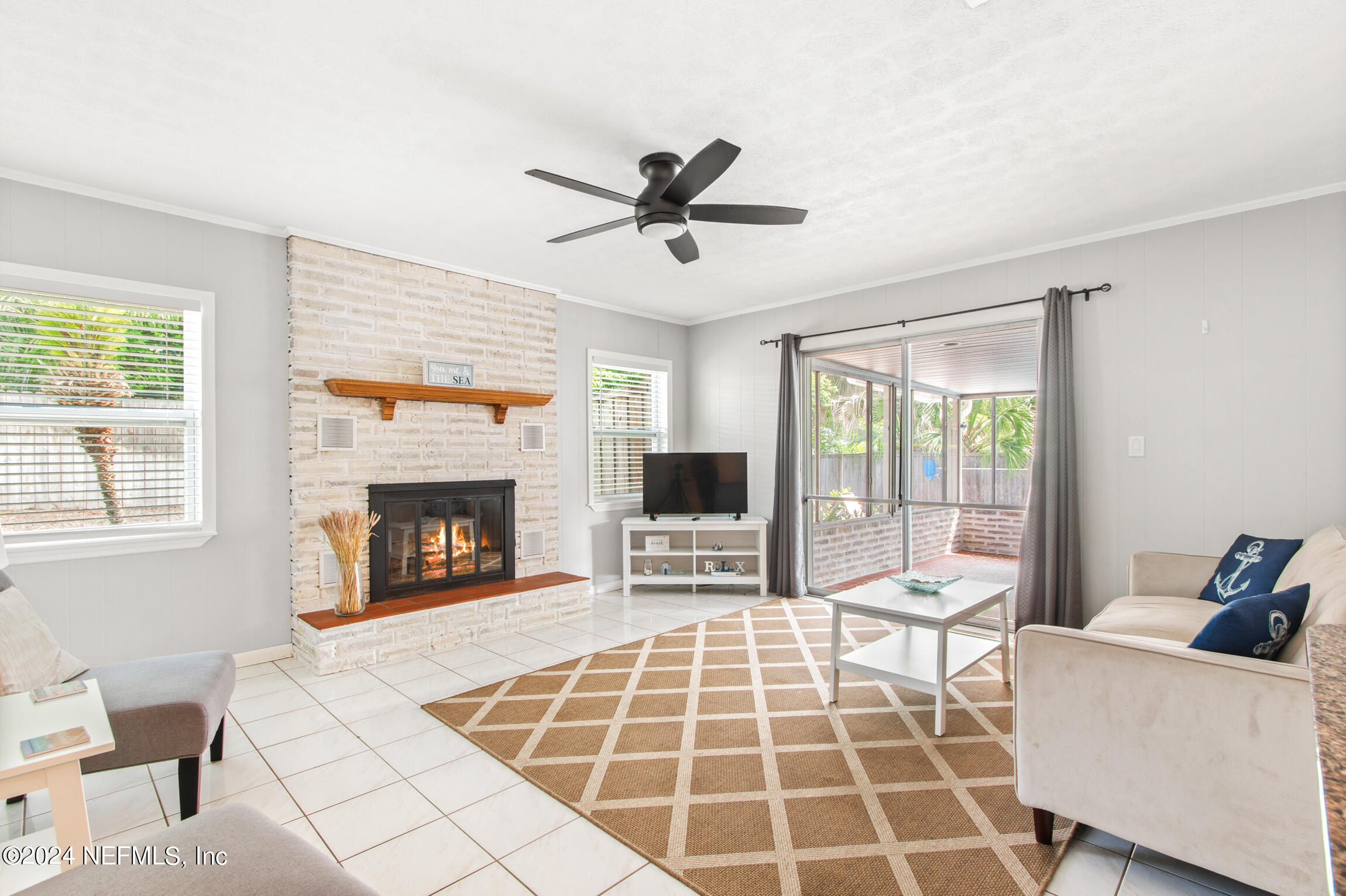 14 Park Terrace Drive St. Augustine, FL 32080 - Photo 16 of 42 a living room with a couch and a fireplace