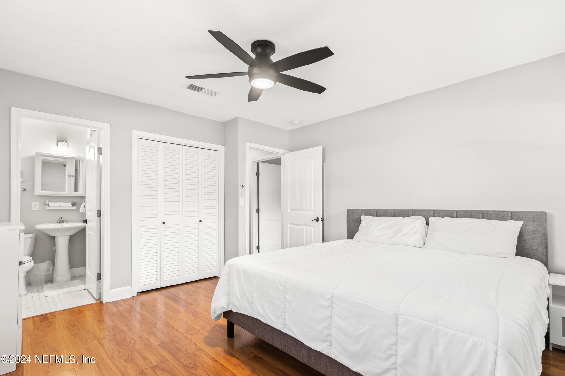 14 Park Terrace Drive St. Augustine, FL 32080 - Photo 30 of 42 a bedroom with a large bed and a ceiling fan