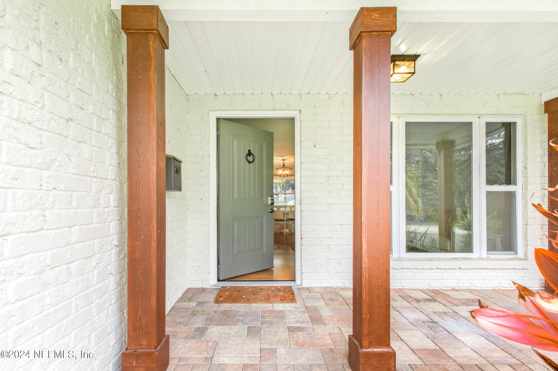 14 Park Terrace Drive St. Augustine, FL 32080 - Photo 5 of 42 a view of a hallway with wooden floor and a bathroom