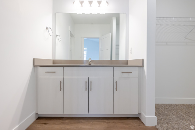 4664 South 680th West, Unit S304 Mapleton, UT 84664 - Photo 8 of 16 White vanity with a single basin sink, light-colored countertop, and chrome fixtures