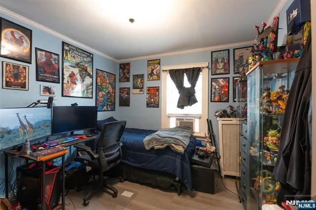 a bedroom with furniture and a fan