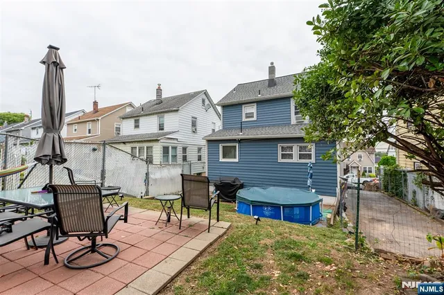 a view of a chairs and table in the patio