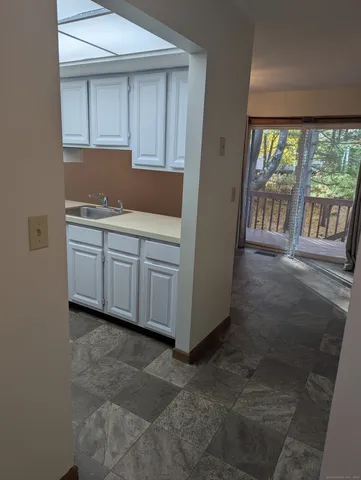 a kitchen with a sink and cabinets