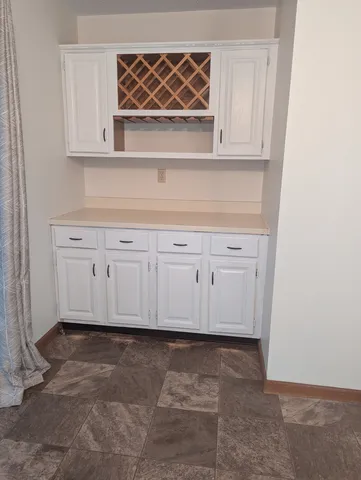 a view of cabinets and window