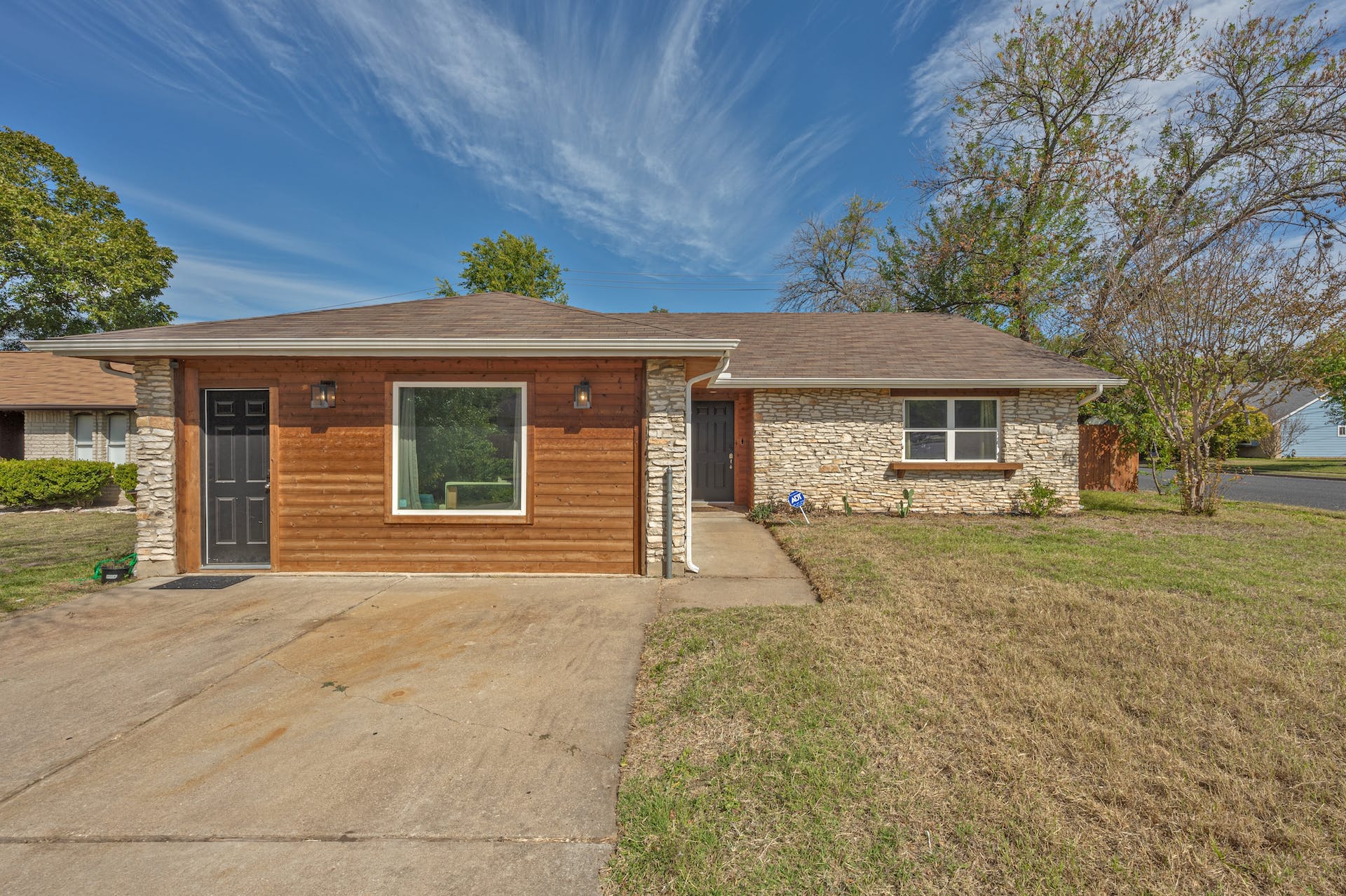 1400 Chippeway Lane Austin, TX 78745 - Photo 1 of 24 Ranch-style home with stone siding and a front lawn