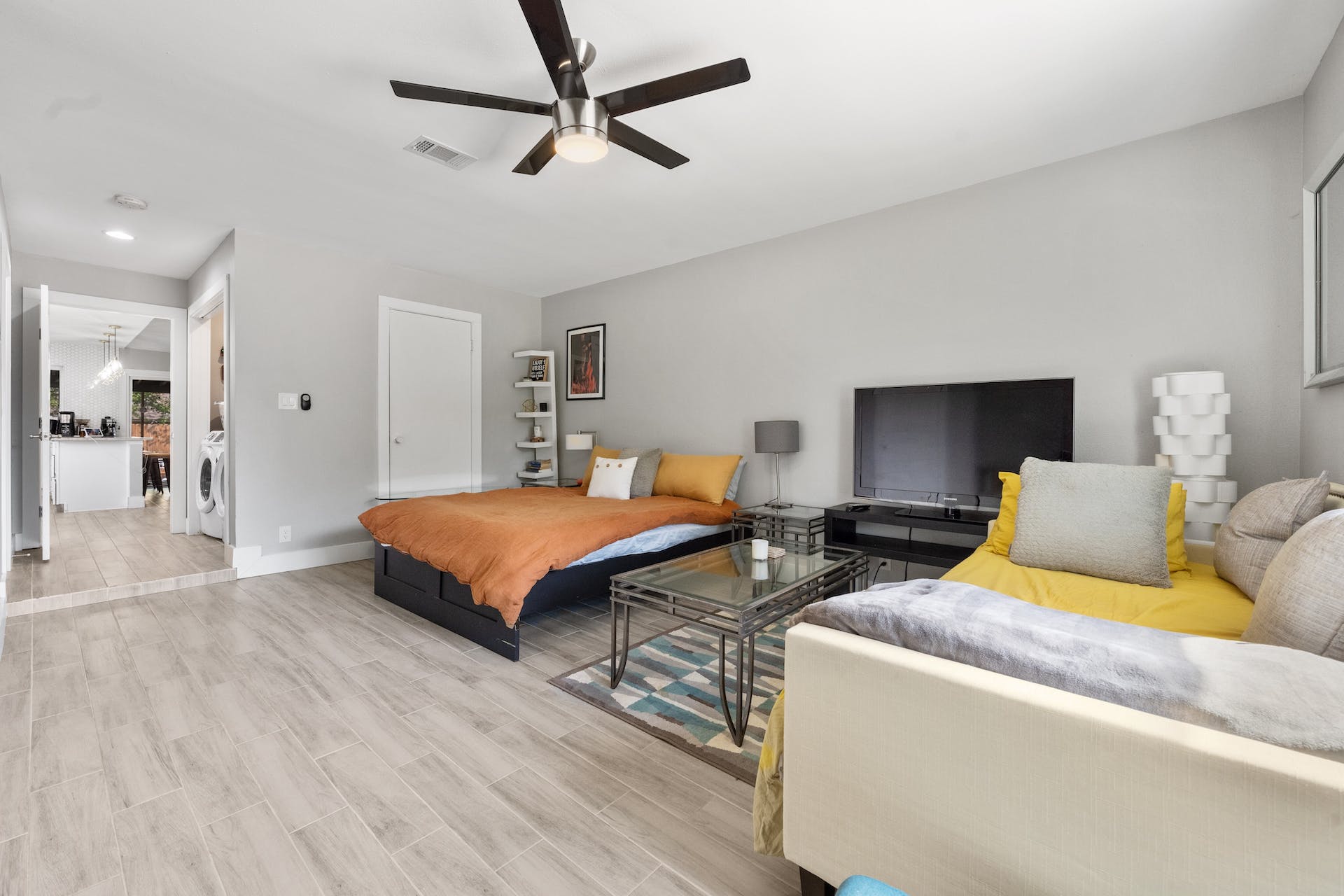1400 Chippeway Lane Austin, TX 78745 - Photo 11 of 24 Bedroom with light wood-type flooring, ceiling fan, recessed lighting, and washer / clothes dryer