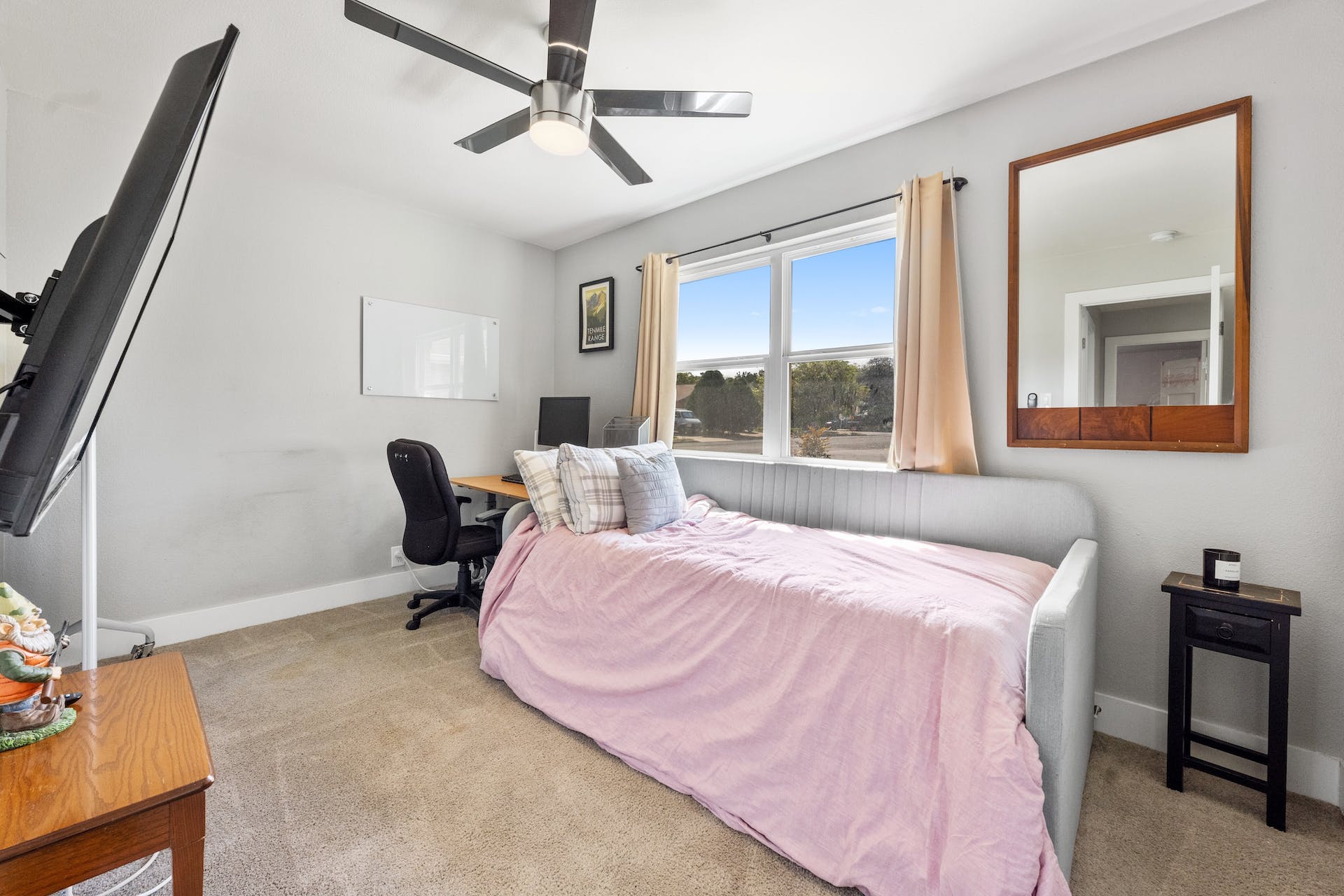 1400 Chippeway Lane Austin, TX 78745 - Photo 16 of 24 Bedroom with an office area, light carpet, and ceiling fan
